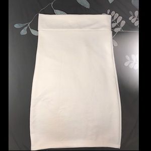 A white knee high skirt.